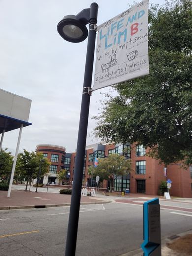 A banner on its light pole, October 8, 2021.
