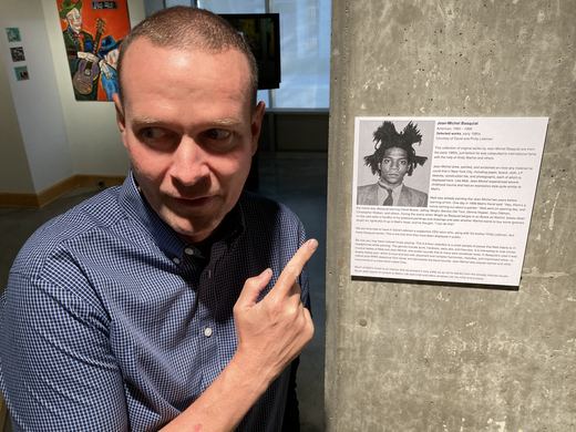 Matt beside the Basquiat wall label.