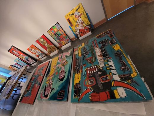 Paintings laid out before shipping to Norfolk, July 7, 2021.
