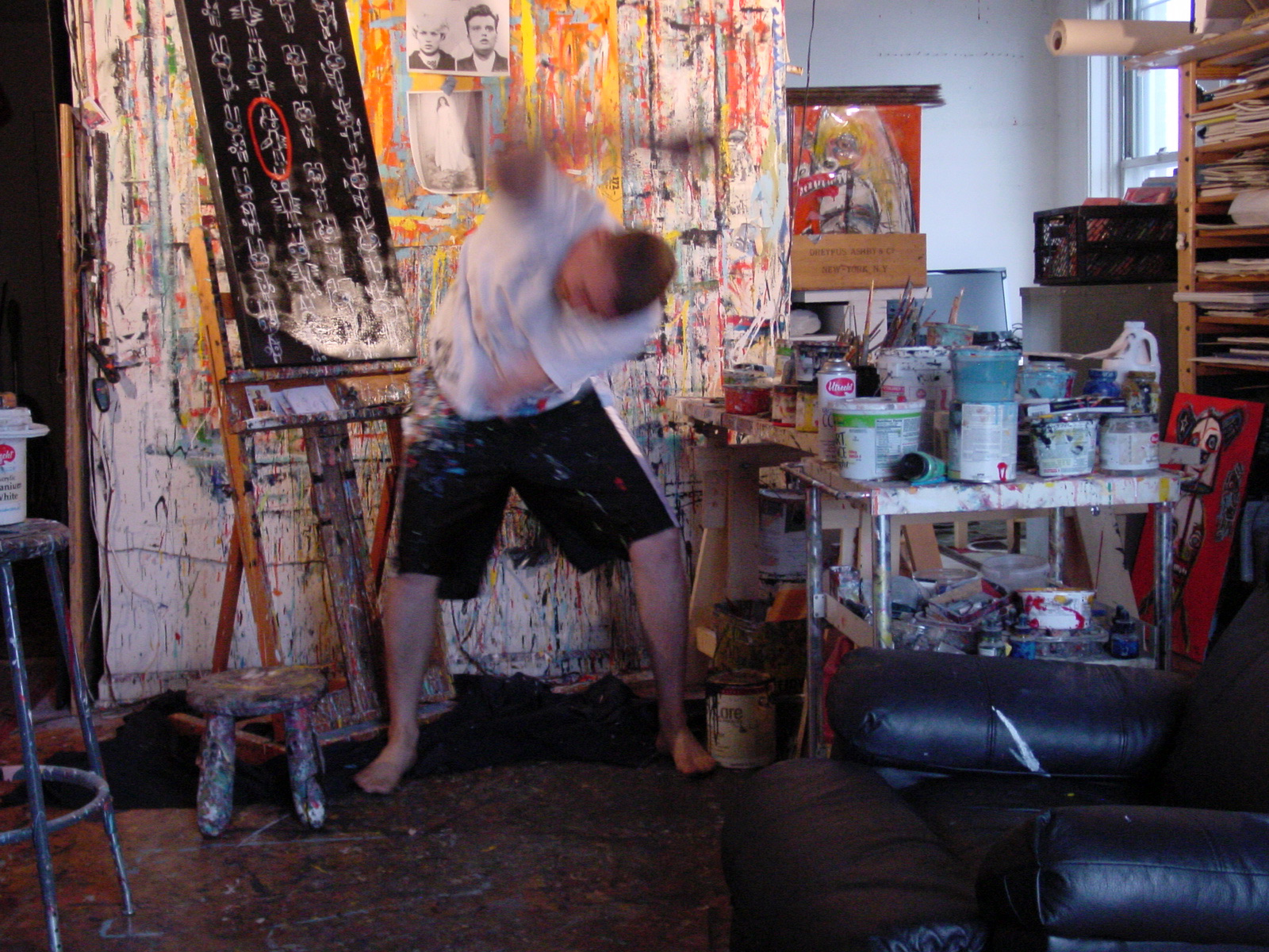 Matt Sesow painting in the Adams Morgan studio, October 2008, frame 1 of 4