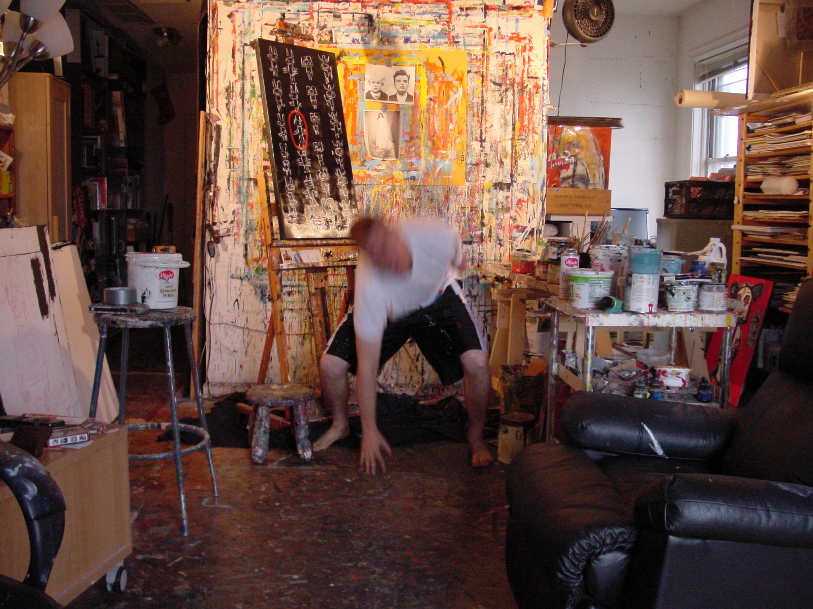 Matt Sesow painting in the Adams Morgan studio, October 2008, frame 3 of 4